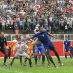 Nepali Player trying to push Corner kick to Goal